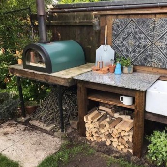 Green Machine no stand Stone Base Pizza Oven in garden
