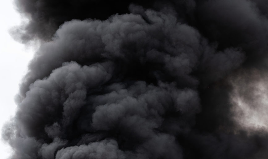 Why is my wood burning stove spilling smoke into the room?