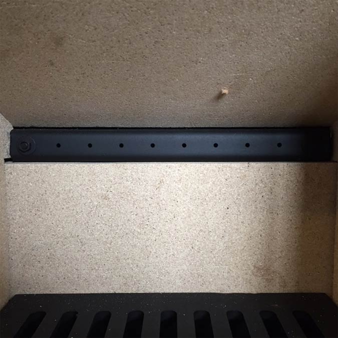 Holes at the rear of a stove with secondary burn